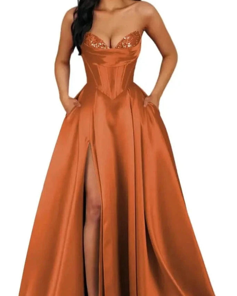 Orange strapless A-line satin dress with sequin bust and thigh-high slit