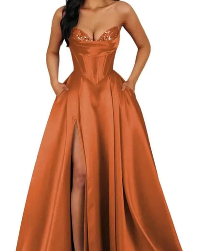 Orange strapless A-line satin dress with sequin bust and thigh-high slit