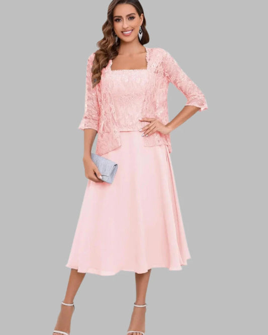 Woman wearing a pink dress with a matching jacket mother of the bride or groom two piece set