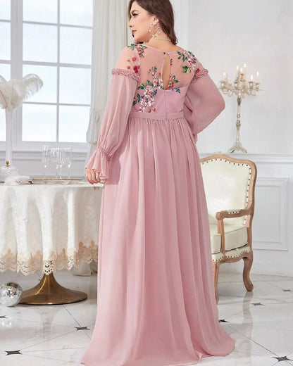 Pink chiffon evening dress back view with floral embroidery, long sleeves and pleated skirt.