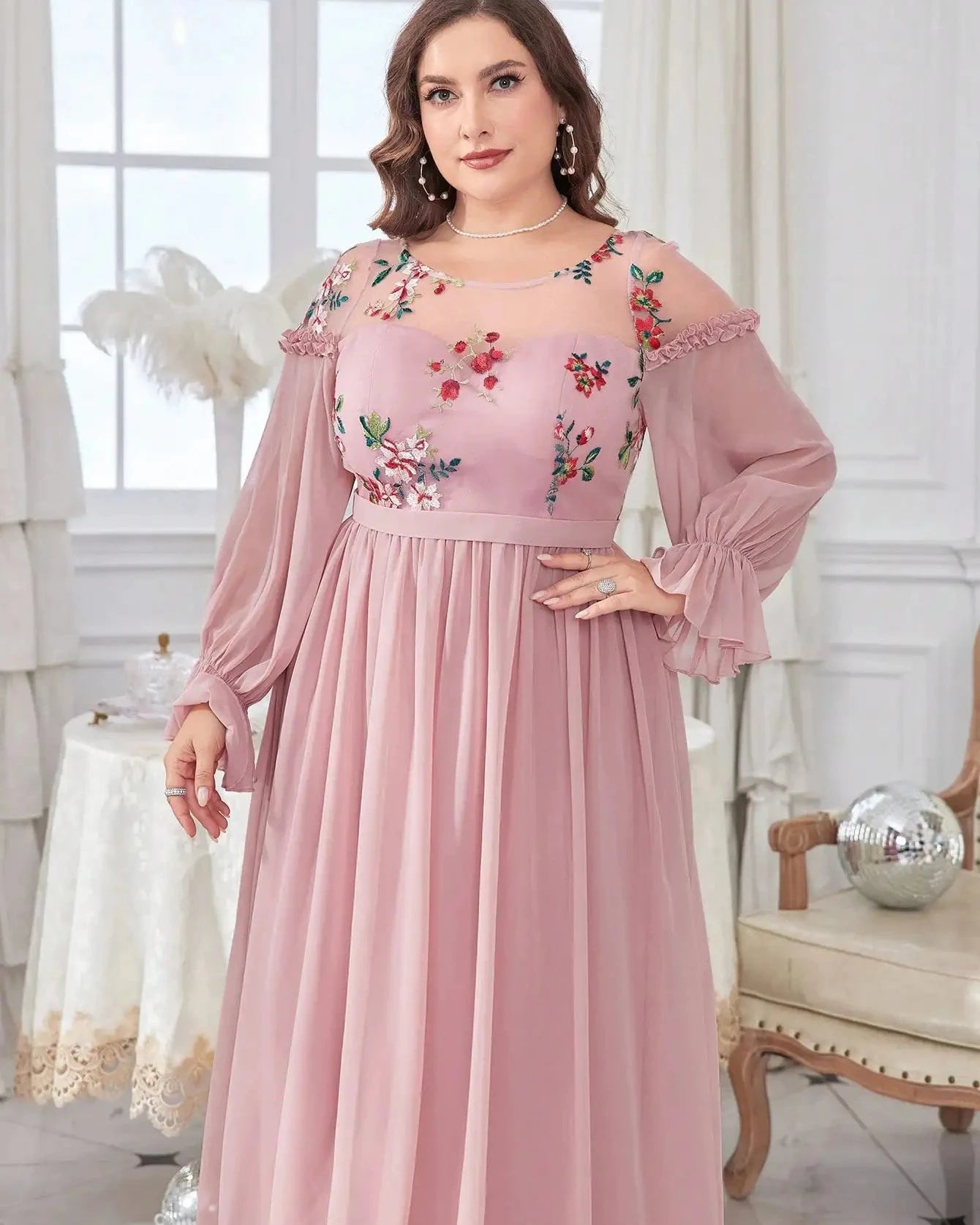 Pink chiffon evening dress with floral bodice embroidery, gathered waist, pleated skirt.