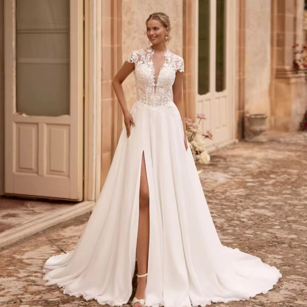 Ivory chiffon A-line wedding dress with lace overlay, V-neck and long flowing skirt