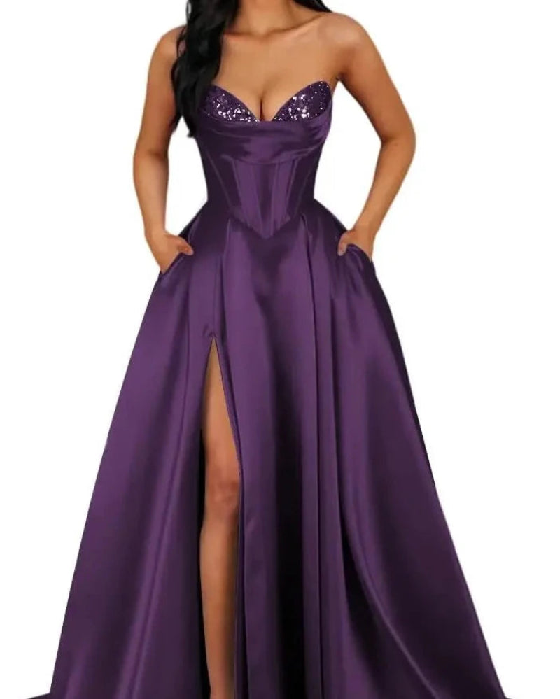 Strapless A-line satin dress with sequin bust and front slit, dark purple.