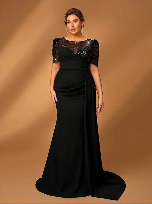 Black evening dress with a round neck and short sleeves decorated with sequins