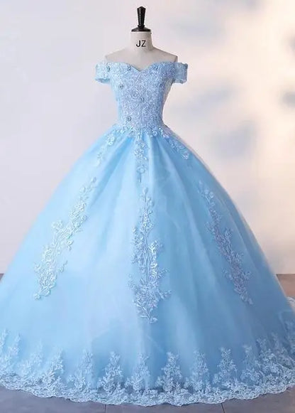 A sky blue lace luxury ball gown with a natural waistline and lace-up back on a mannequin.