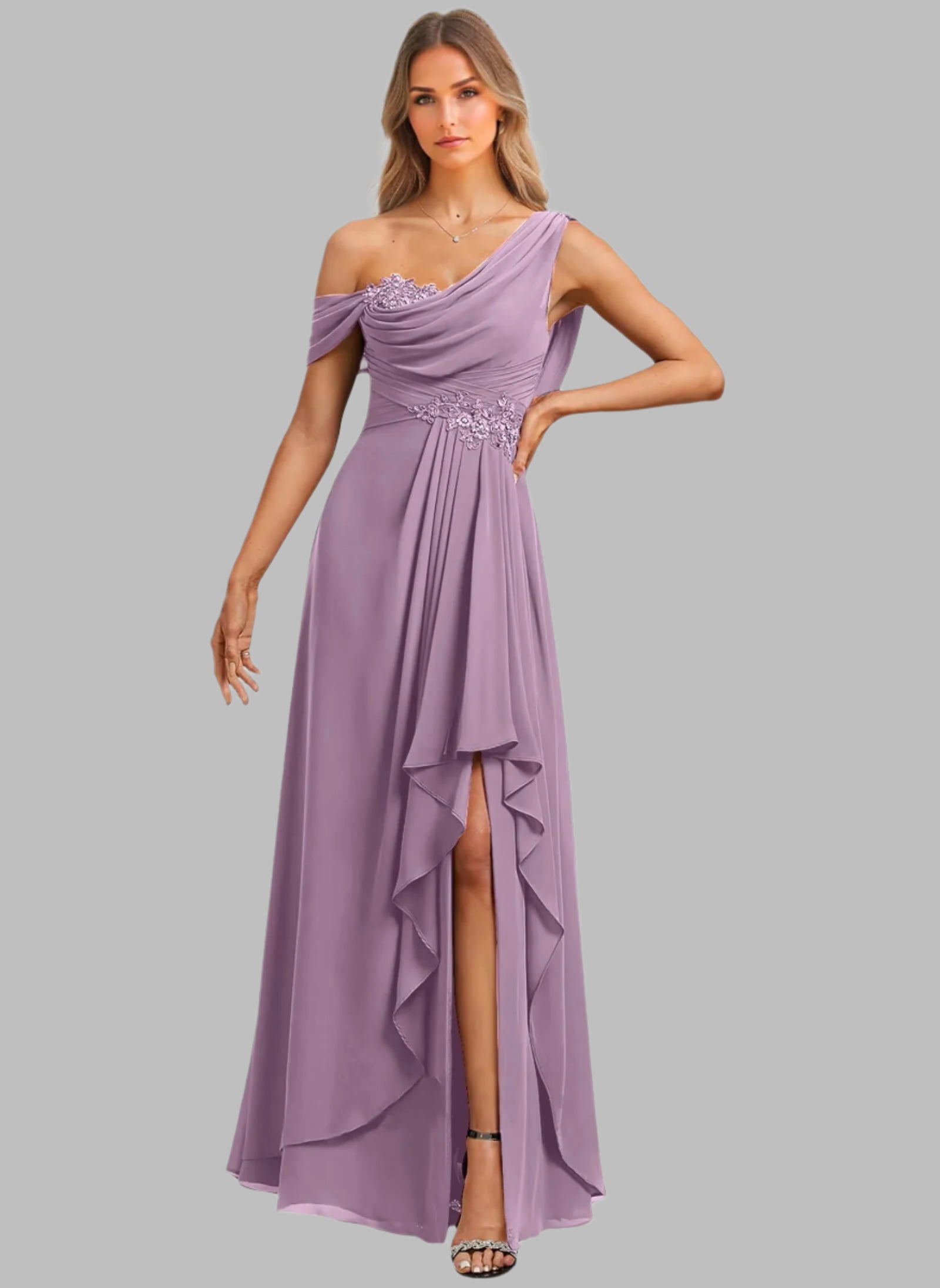 Woman wearing a purple one-shoulder evening gown with beaded details on a white background