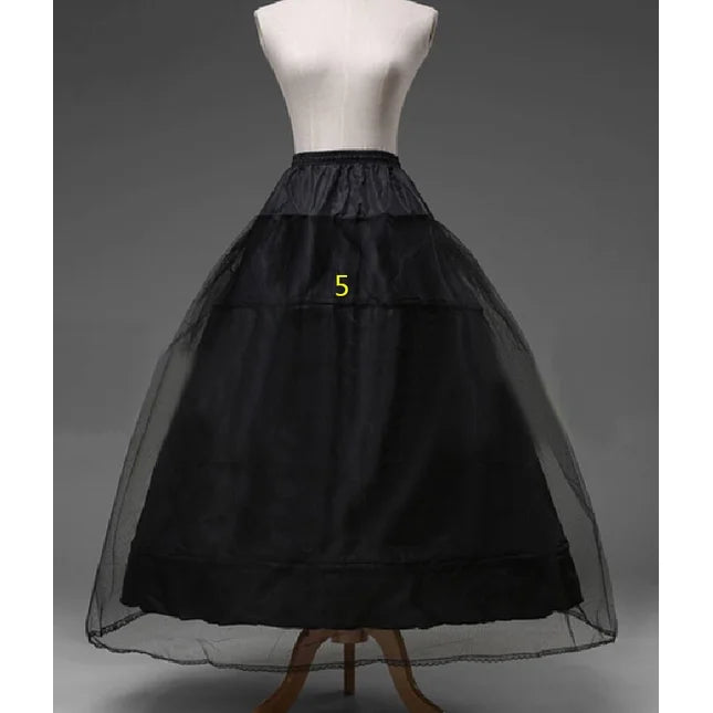 Black petticoat on dress form, tiered tulle and satin band at waist