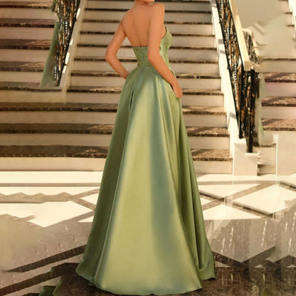 Green strapless satin A-line maxi dress with gathered waist detail and voluminous skirt