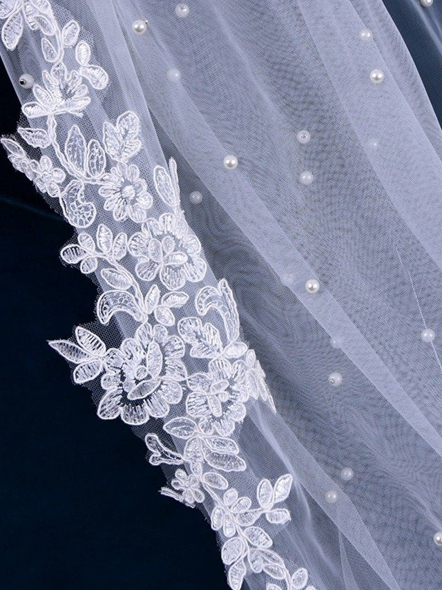 Tulle bridal veil with floral lace border and pearl dot detailing