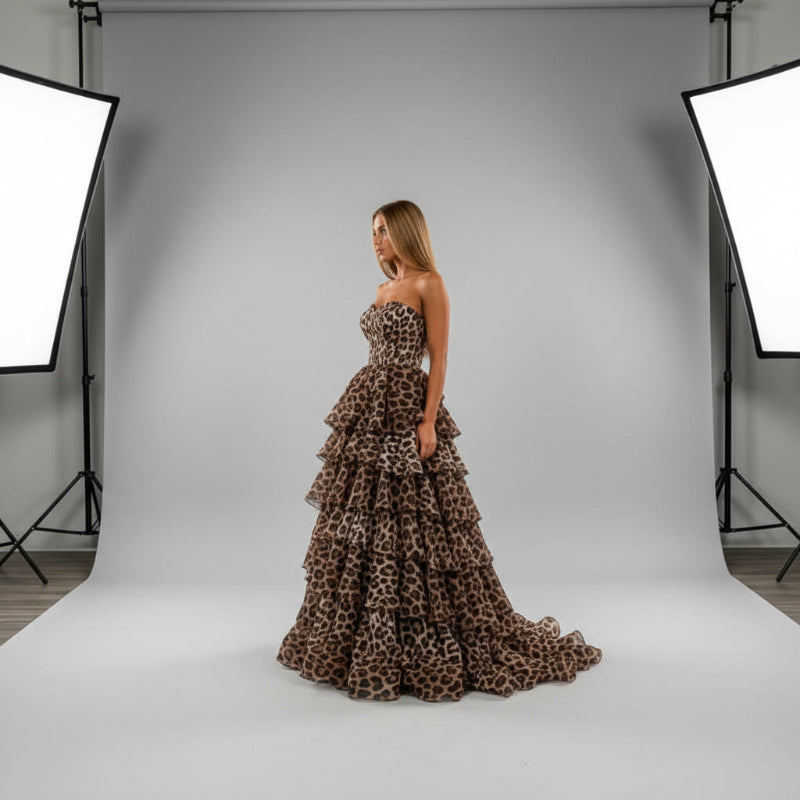 Leopard print strapless formal dress with layered ruffle tiers and structured corset bodice