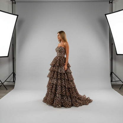 Leopard print strapless formal dress with layered ruffle tiers and structured corset bodice