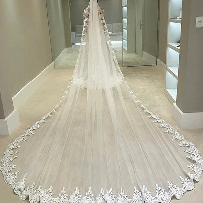 Cathedral wedding veil with sheer tulle and ornate lace scalloped edge
