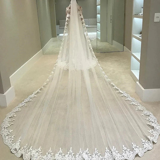 Cathedral wedding veil with sheer tulle and ornate lace scalloped edge