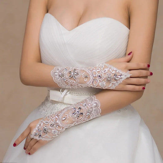 White lace and sequin fingerless bridal gloves. Forearm length with finger hook and ribbon lace up to keep secure.