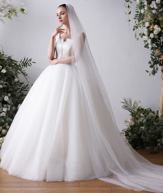 Cathedral bridal veil in white sheer tulle, plain cut edge, long flowing length